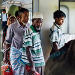 Rohingya passengers get off the train ahead of Sittwe, Rakhine state, as they are not allowed to disembark at the main station. The ethnic minority fear going out in case they are conscripted. Photograph: Riva Press
